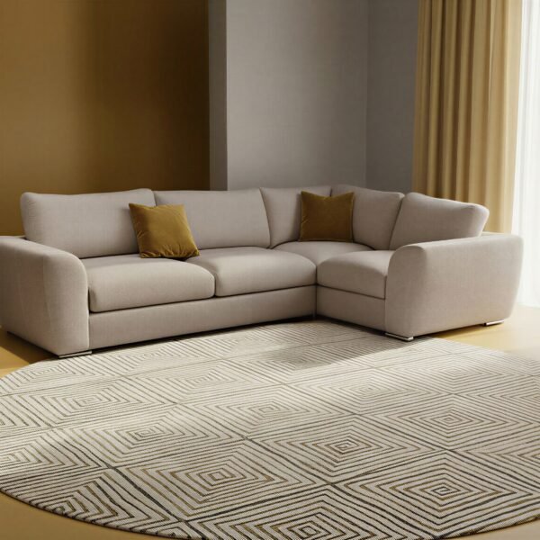 Stone-coloured L-shaped corner sofa styled in a warm-toned living room with round patterned rug
