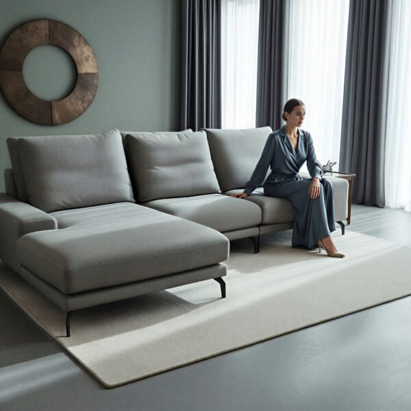 Light green linen-weave corner sofa with chaise and tapered legs in a modern living room