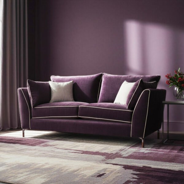 Aubergine velvet 3 seater sofa with cream piping and tapered bronze legs