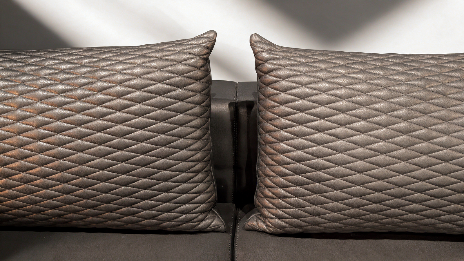 Quilted black faux leather scatter cushions