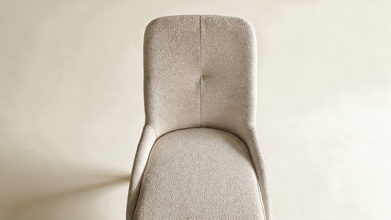 Tailored high-back swivel chair, close-up of padded grey backrest