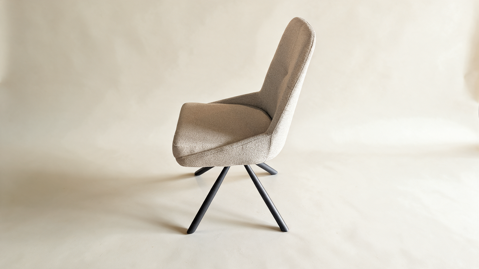 Tailored high-back swivel chair in grey fabric, side view