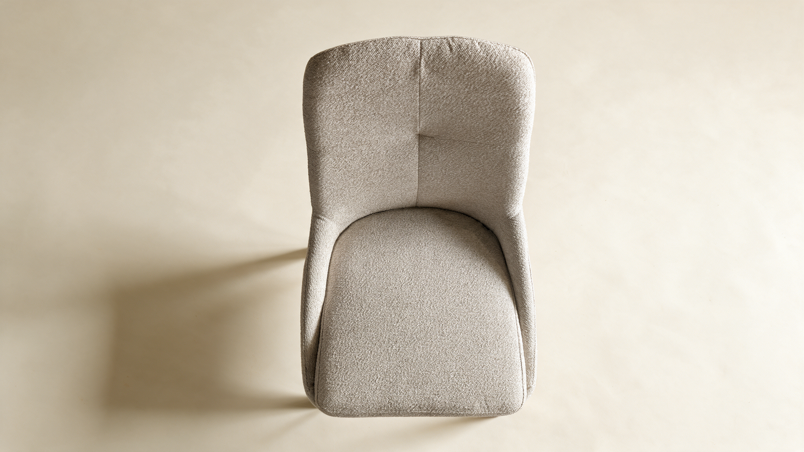 Tailored high-back swivel chair in grey fabric with black metal legs, front view