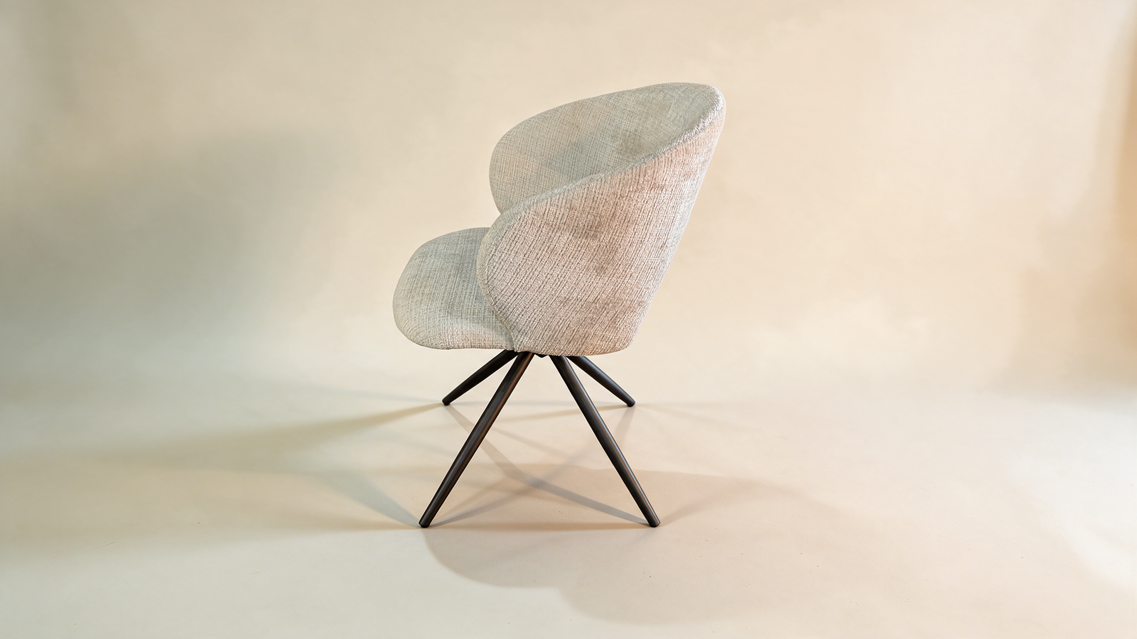 Boucle swivel accent chair with cut-out back, angled view