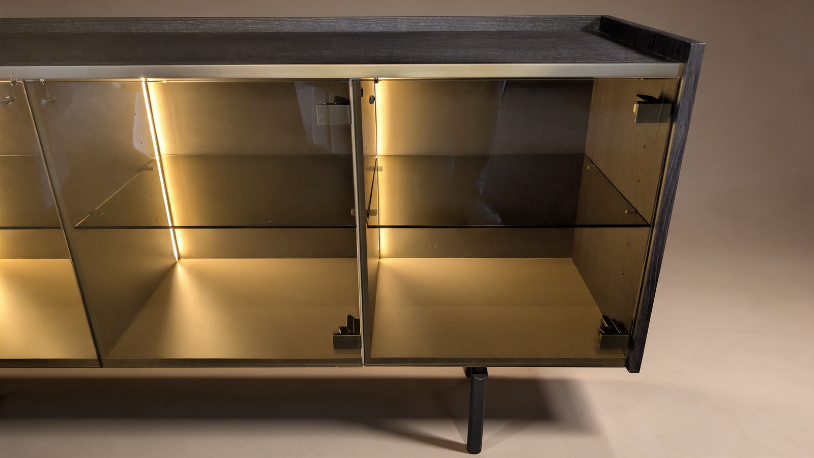 Ebonised ash sideboard with smoked glass display shelves lit by LED lighting