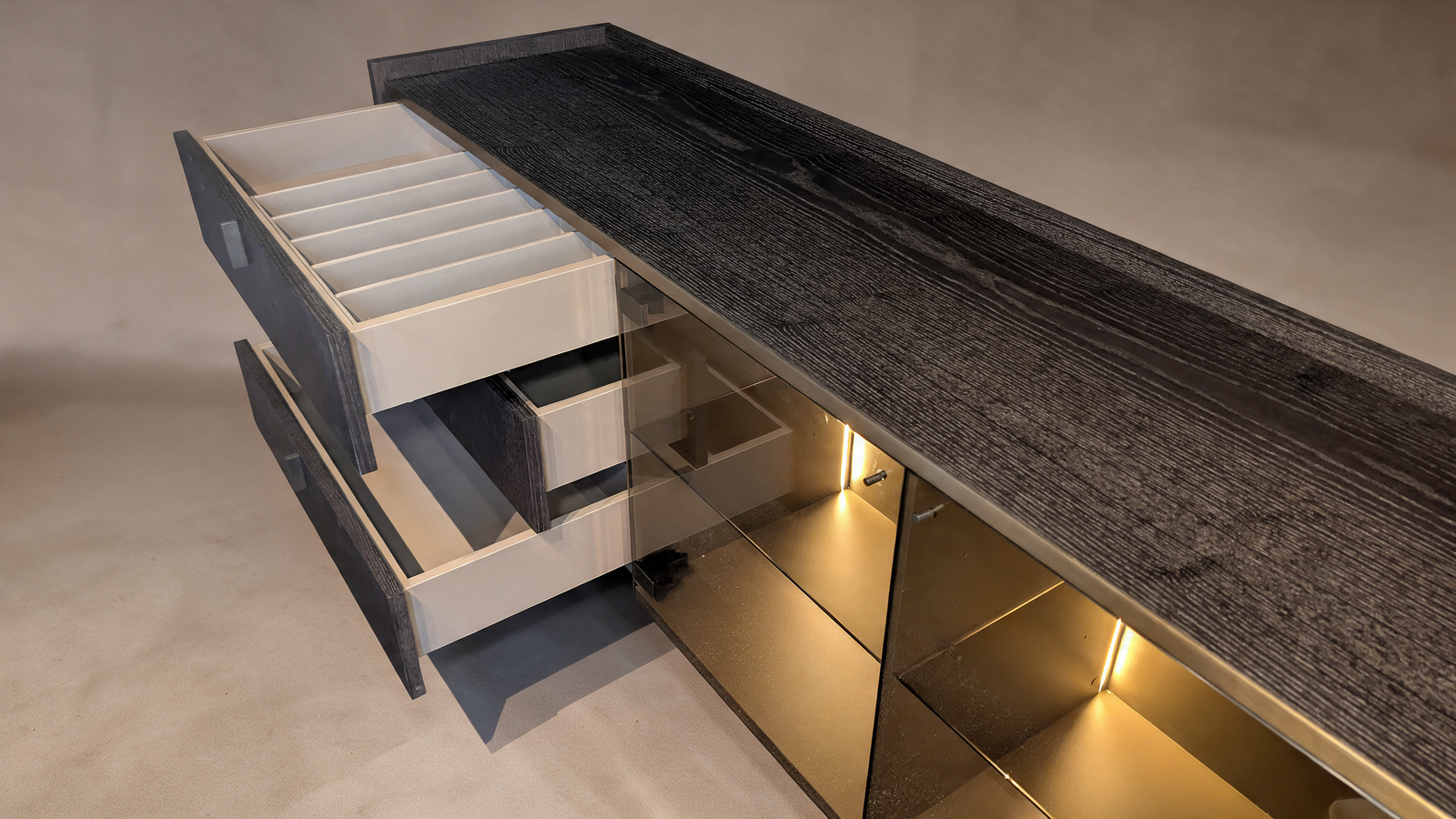 Ebonised ash sideboard with open drawer and LED-lit display shelf