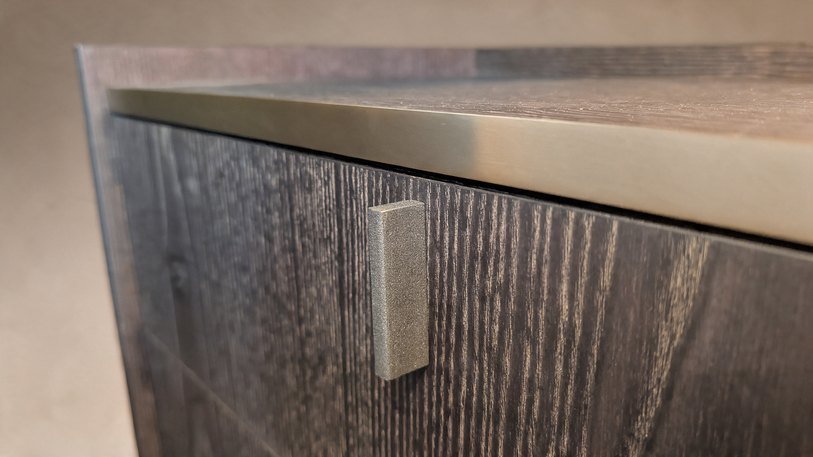 Ebonised ash sideboard, close-up of textured door and handle