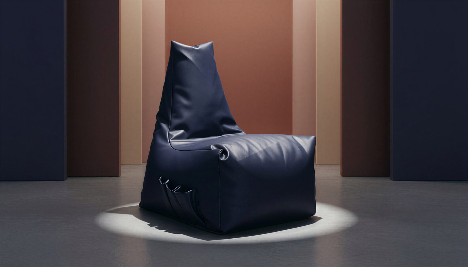 Navy bean bag lounger chair on a dark studio backdrop